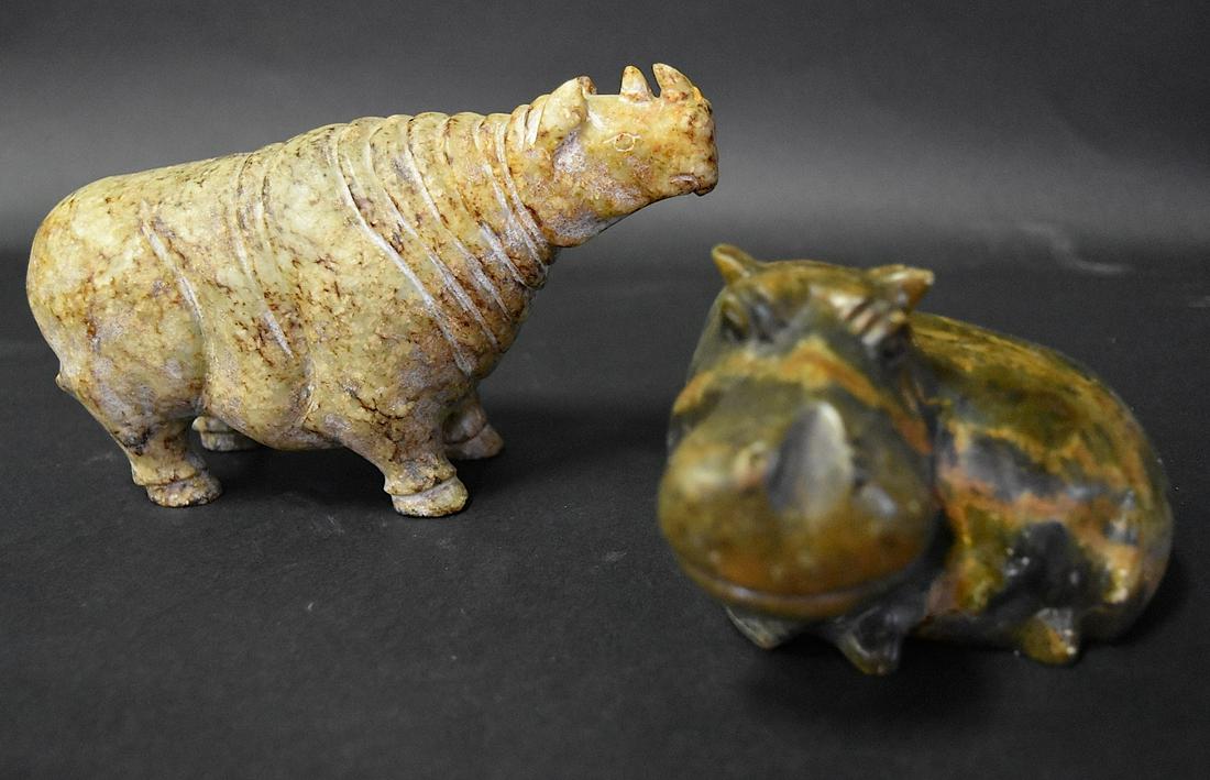 Two(2) Carved Stone Animals: Including: carved hardstone rhinocerous, 4.5in.H. x 7in.L.; carved soapstone reclining hippopotamus, 3.25in.H. x 5in.W.