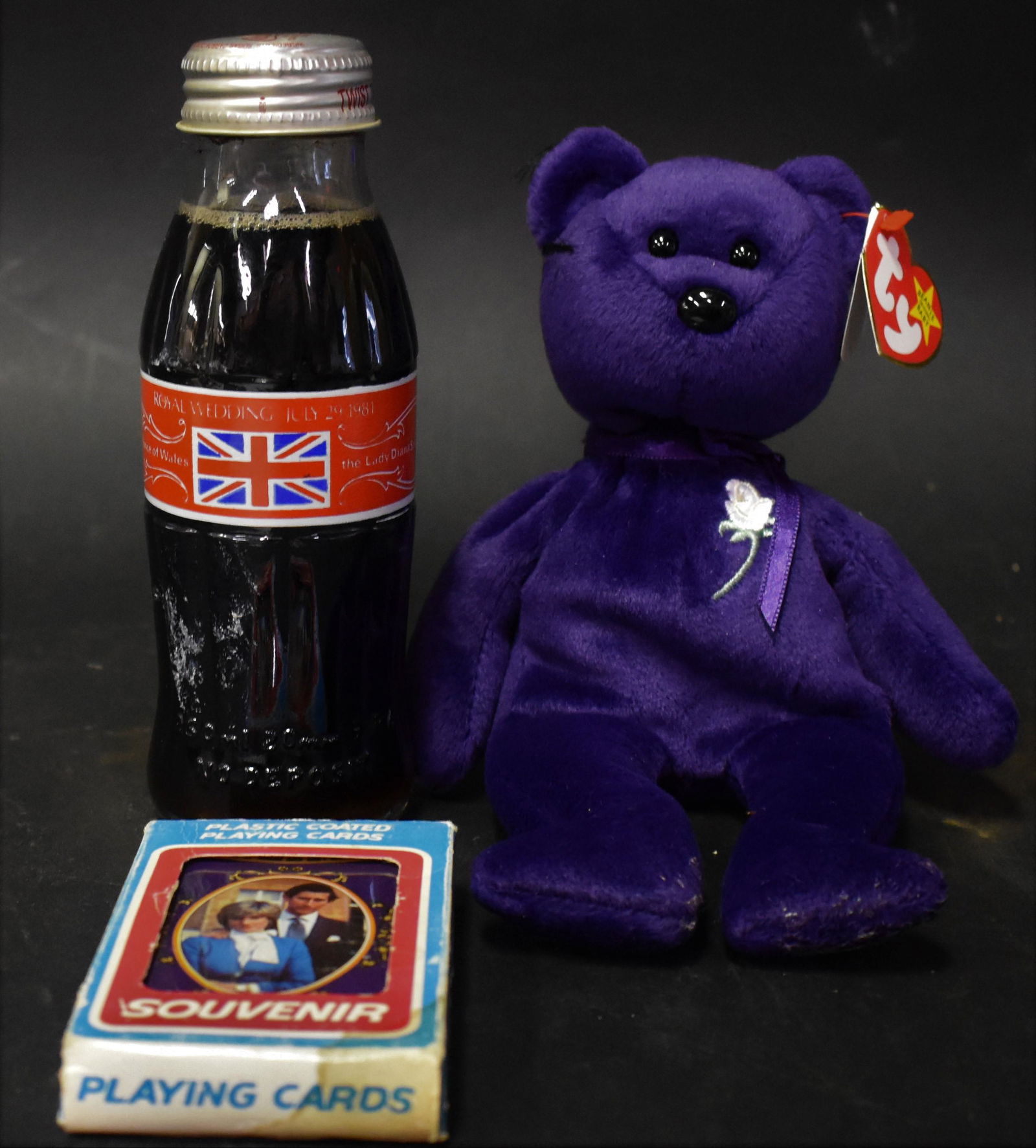 Collectors Lot of Princess Diana (3): Collectors Lot of Princess Diana (3) Princess Diana Beanie Baby, Commemorative playing Cards honoring Prince Charles and Diana's Wedding, 1970's Coca Cola Bottle Commemorating the Royal Wedding.