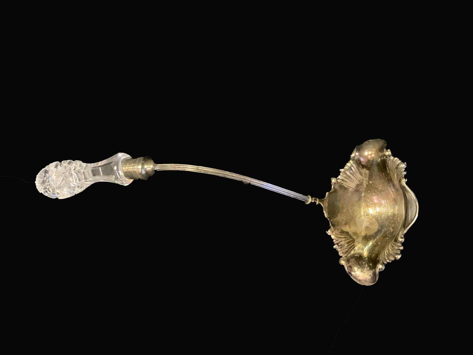 Pairpoint Brilliant Cut Glass and Silverplate Ladle: Ornate brilliant cut glass and silvered plated ladle. Marked Pairpoint Mfg. Co.; 13.5in.H.