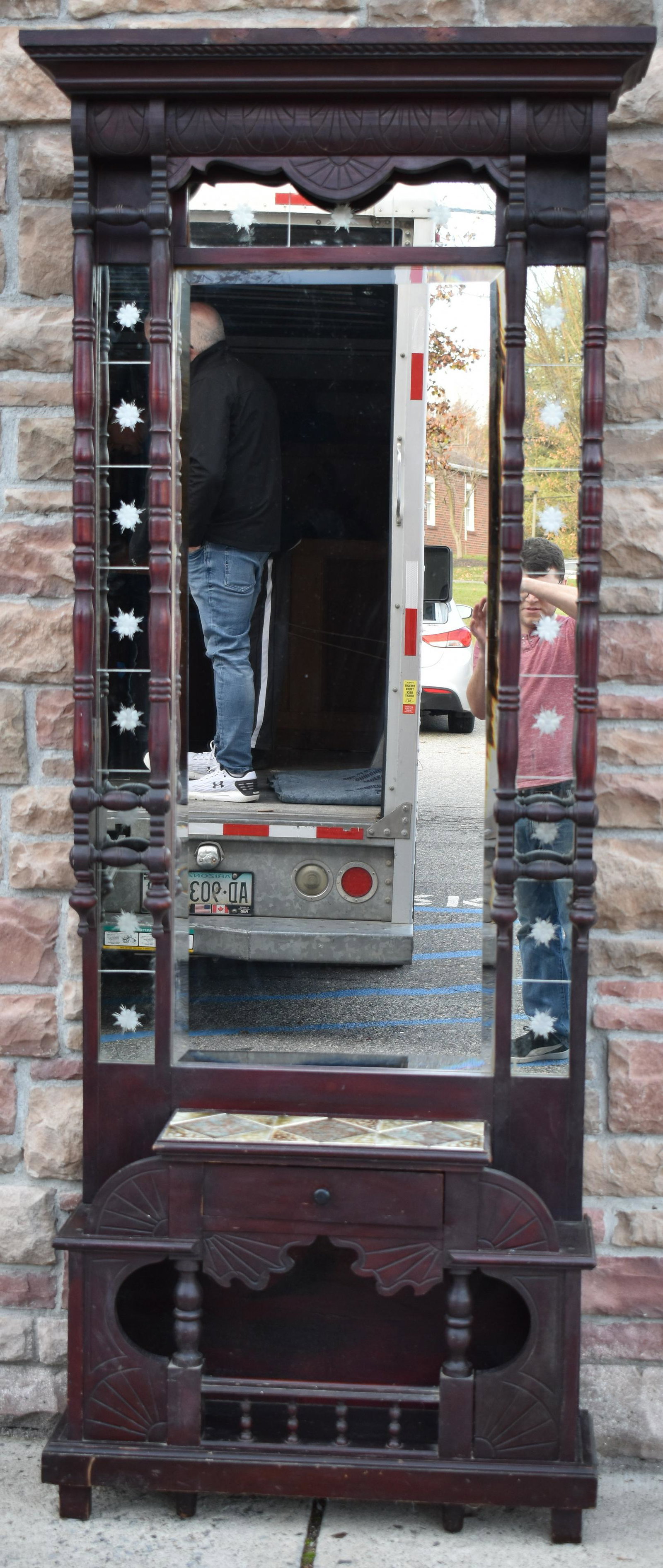 Victorian Ornate Walnut Hall Stand: One drawer. Mirror. Shelf beneath. Tiled above the drawer. 85"H. 35"W/ 10"D
