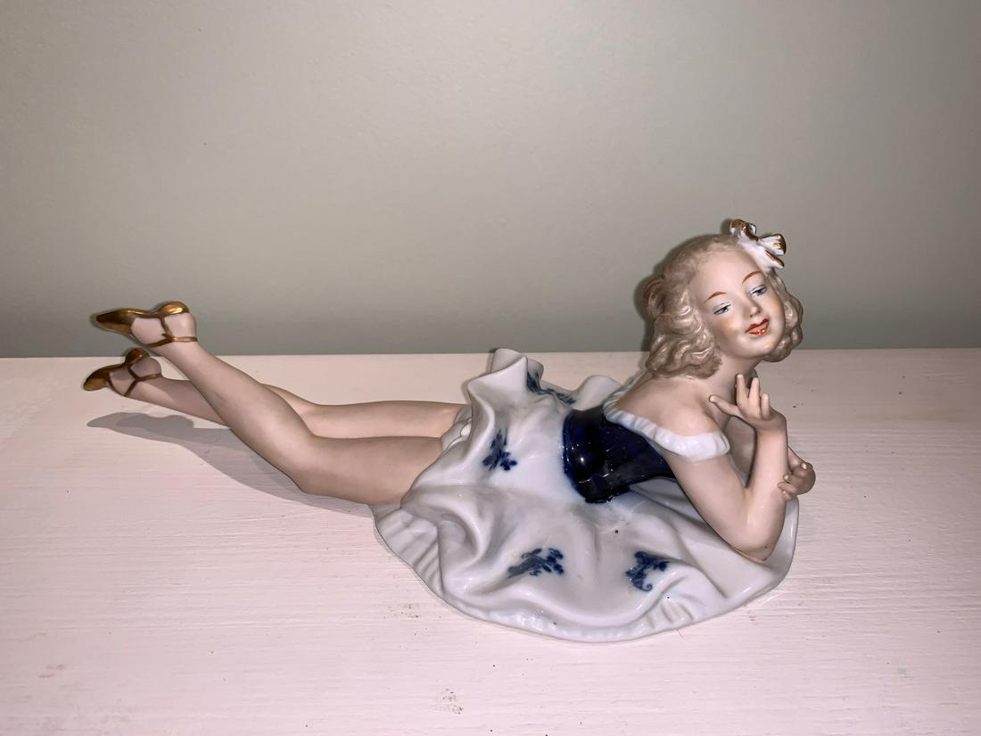 Dresden Porcelain Figure of a Reclining Ballerina: Hand painted porcelain figure of a reclining ballerina. Marked at the underside; 4.5in.H. x 10.5in.W.