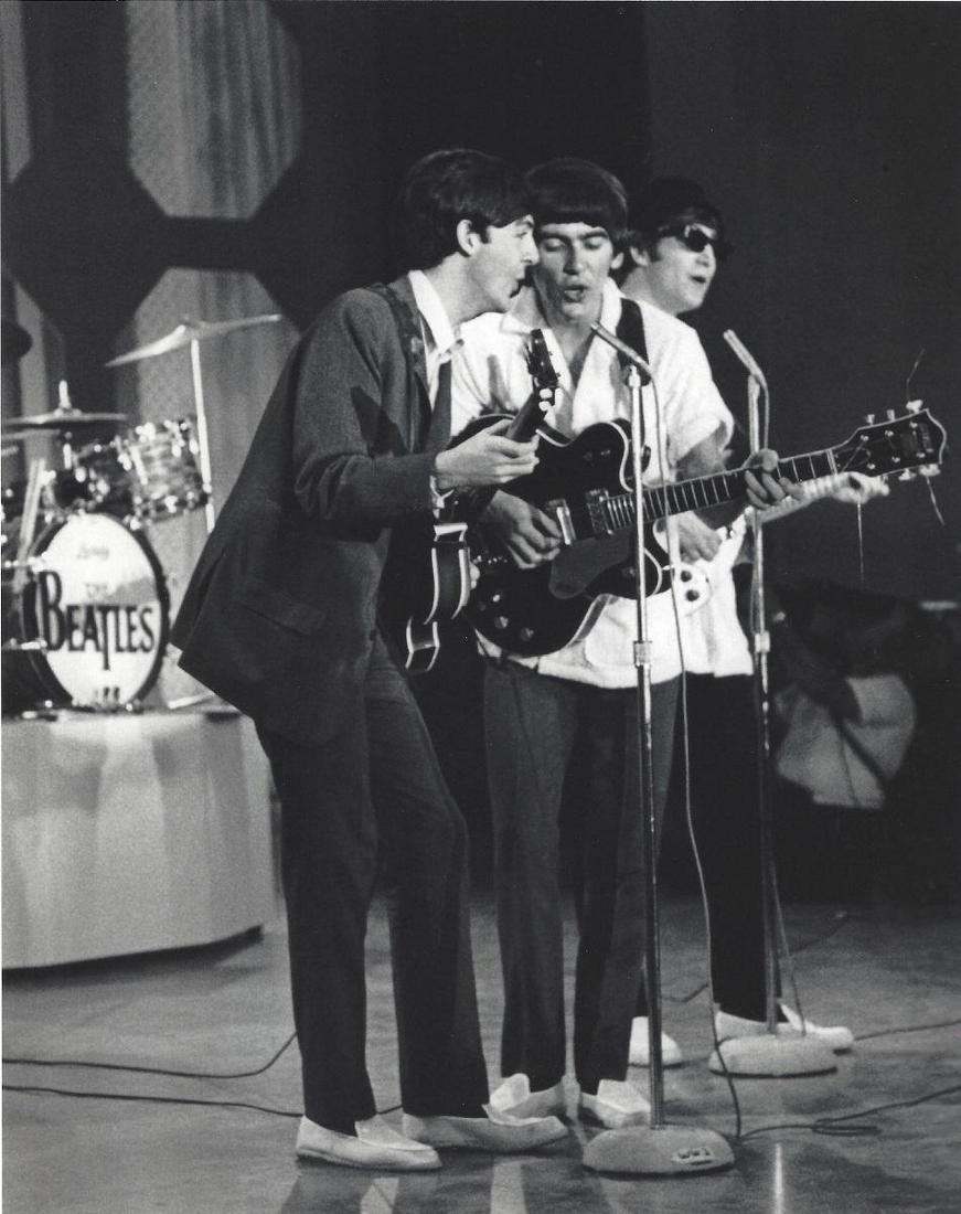 The Beatles Ed Sullivan Show Harry Benson Photo: Original Publication Photo, measuring approximately, 11"x9" includes white border. Taken in 1964, printed 1997. It comes stamped by the photographer and agency. The photograph is printed on double wei