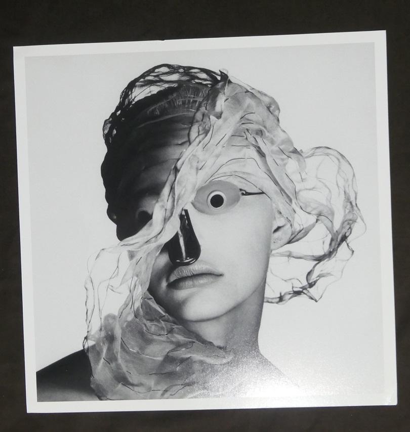 Irving Penn Girl With Goggles Publication Photo: Original Publication Photo, measuring approximately, 10"x9" includes white border. Taken in 1994, printed 1999. It comes stamped by the photographer and agency. The photograph is printed on double wei
