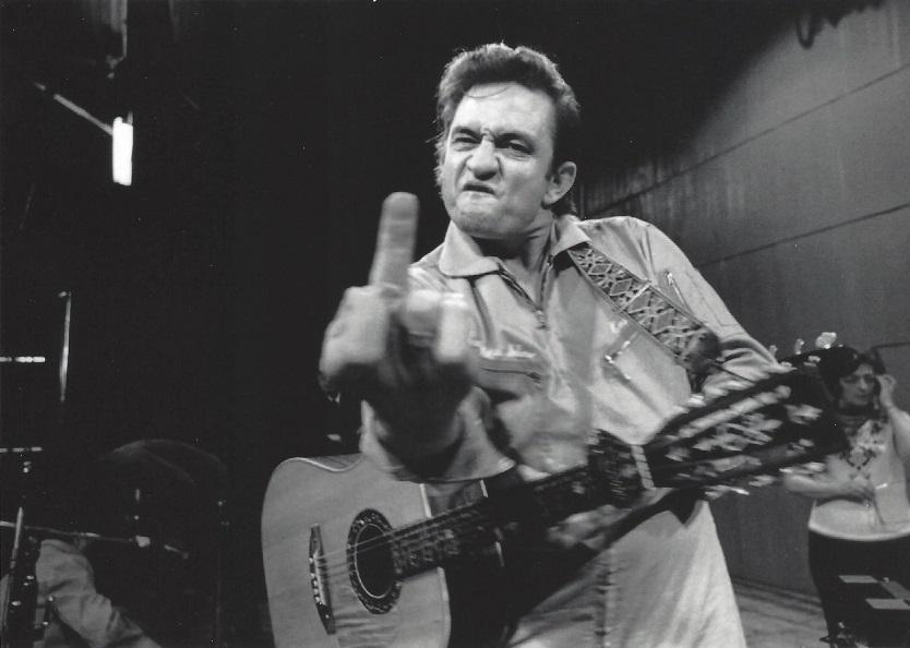 Johnny Cash Jim Marshall Publication Photo: Original glossy Publication Photo, measuring approximately, 7.5"x5.5" includes white border. Taken in 1970, printed 1999, San Quentin Prison. It comes stamped by the photographer and agency. The photo