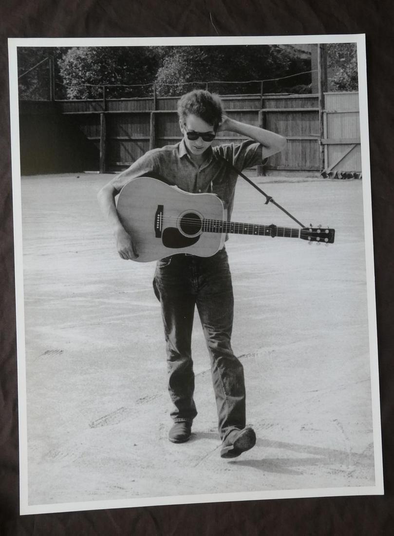 Bob Dylan Newport Jim Marshall Publication Photo: Original Publication Photo, measuring approximately, 12.5"x16.5" includes white border. Taken in 1963, printed 1998. It comes stamped by the photographer and agency. The photograph is printed on doubl