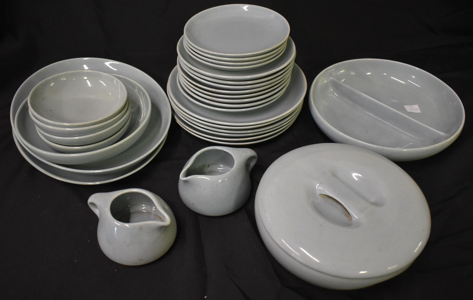 Russel Wright. Dinner Service for Iroquois: Marked Russel Wright China For Iroquois. 6 dinner plates, 8 salad plates, 4 dessert Plates, 4 shallow bowls, 2 platters, Serving bowl, covered casserole, two creamers, and divided dish.