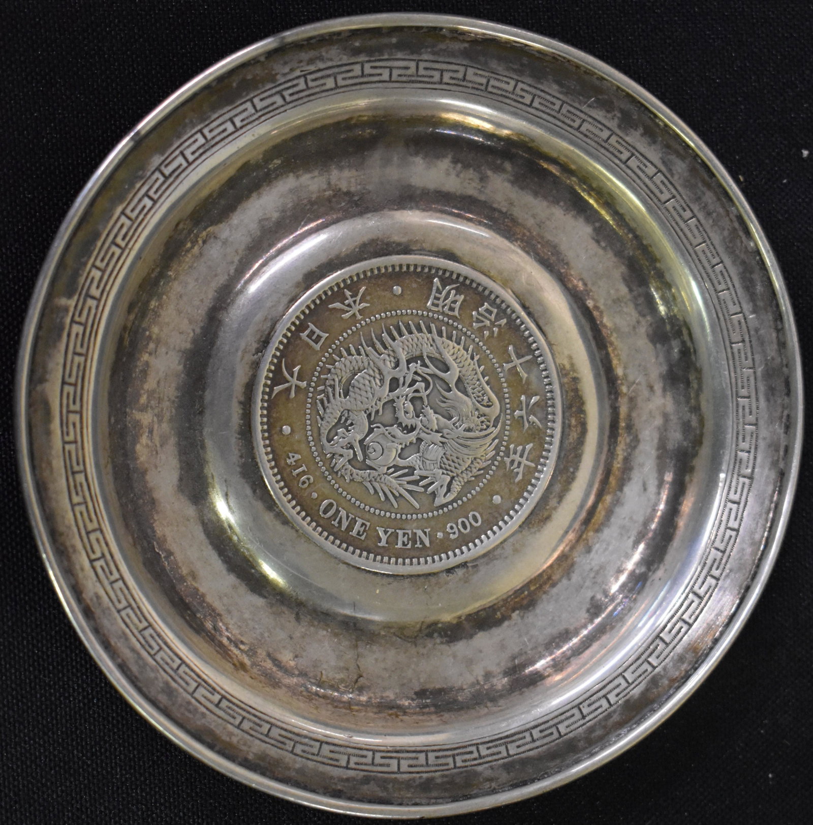 Japanese Sterling 1 Yen Tray: Center Mounted with 1 Yenn Coin. Hallmarks at underside for WS and japanese characters for sterling. Aprox 4"D