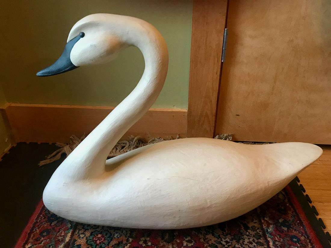 Artist Carved Wooden Swan, Signed JRH: Carved white painted wood swan. Signed in black. Carved letters JRH. Paper label for Aris Americana, Inc. Tilghman Island, MD. 21671. Made in USA. 24.5" Long x 17.24" H