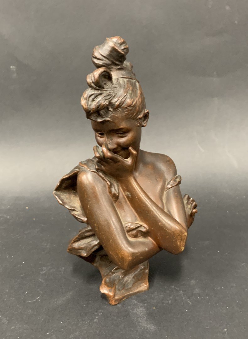 19thC. Art Nouveau Bronze Bust of a Girl: Bronze bust of a girl. Inscribed with itials L.G. and impressed with foundry mark; 7in.H. x 4in.W.