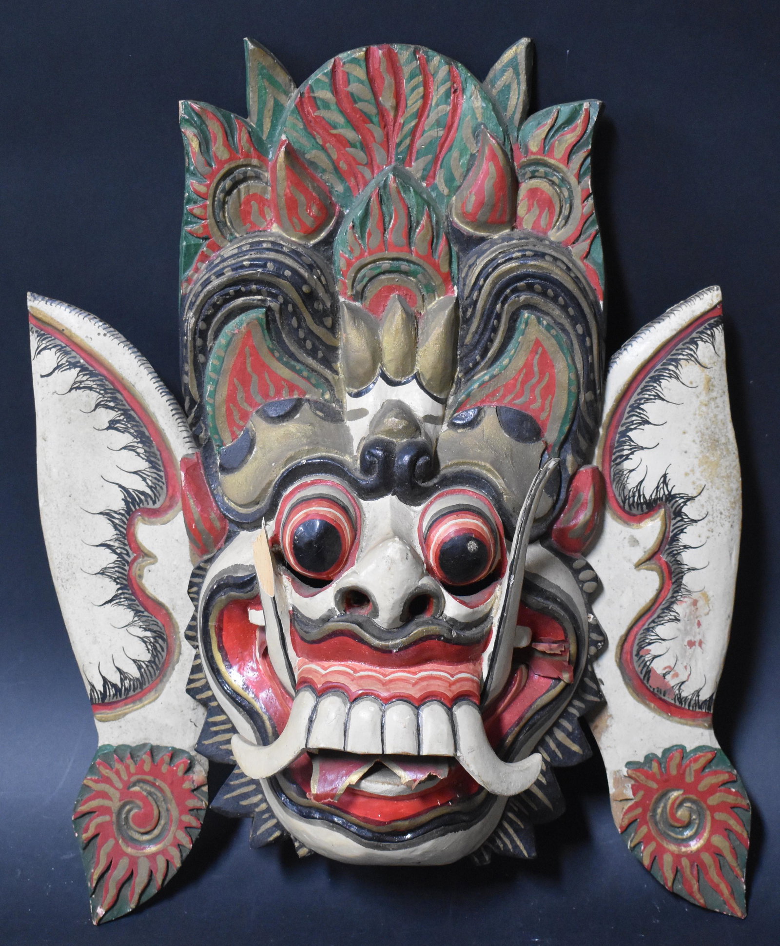 Balinese Wood Carved Mask: Balinese Wood carved and Painted mask.****This, an item from a local elder, older than his 60 years, up until this past month, a very active, eclectic and constant collector. Responding to recent heal
