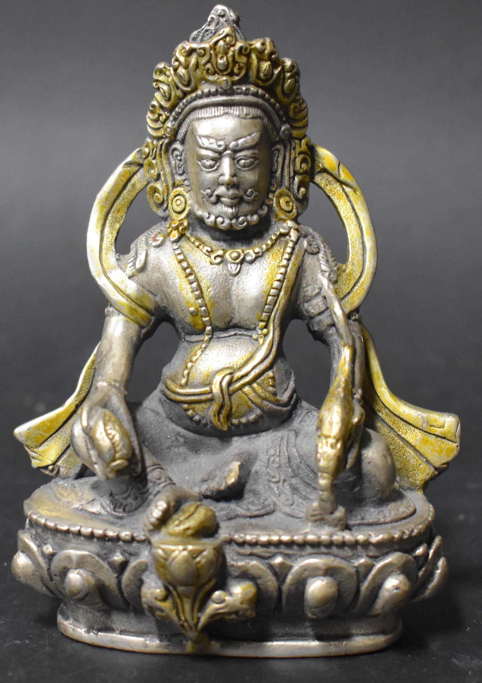 Tibetan Silvered and Gilt Buddha: Seal on Bottom. Size 4.5"H.****This, an item from a local elder, older than his 60 years, up until this past month, a very active, eclectic and constant collector. Responding to recent health news, he