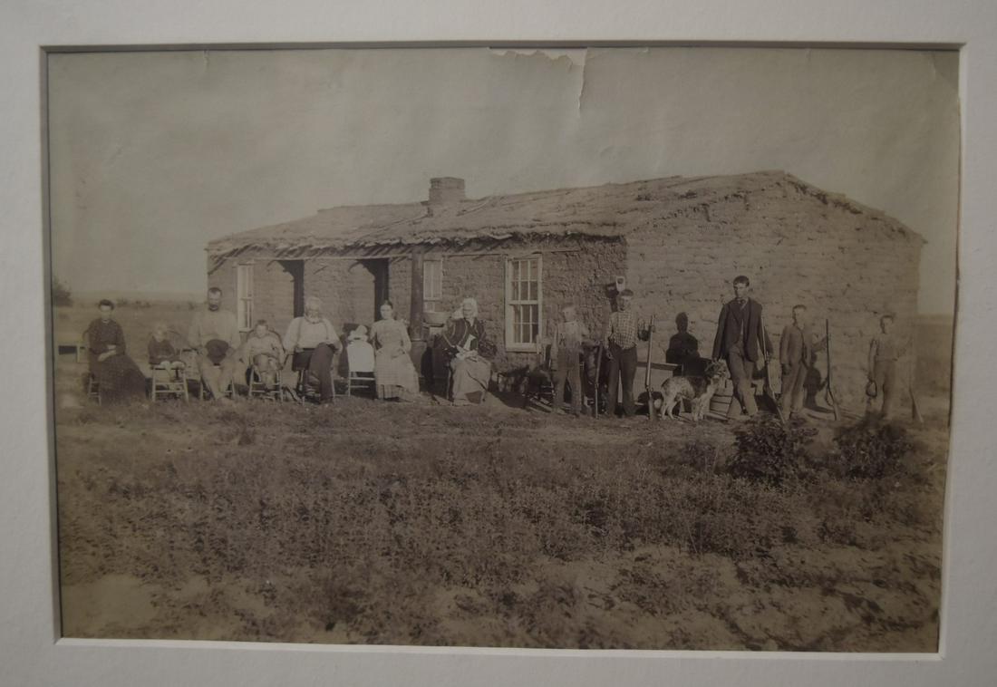 Attr Solomon Butcher Settlers and Sod House: "Settlers and Their Sod House" Several generations, the boys with rifles and hunting dog. C. 1890's 5"x8" Overall 20"x16"