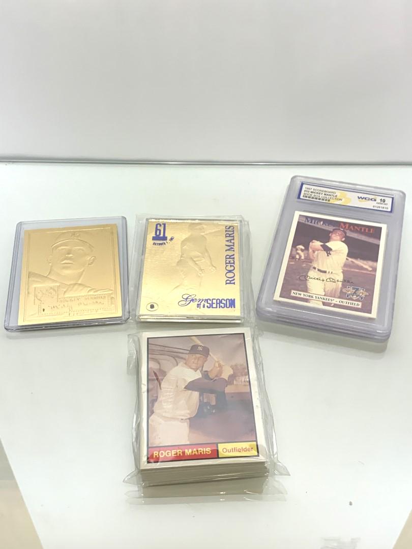 Lot of Miscellaneous NY Yankee Baseball Cards: Including: 1961 Word Champions set; 1997 Scoreboard #59 Mickey Mantle(in case); 1986 Topps #405 Roger Maris(in case); two(2) others