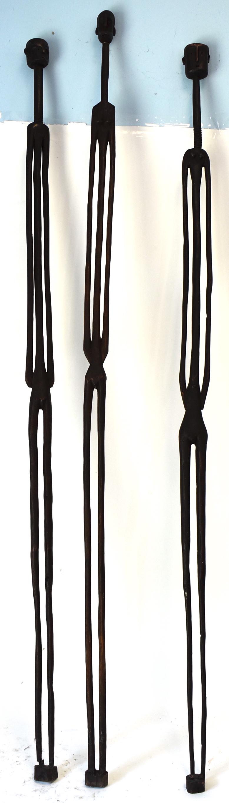 East African Pole Figures (3): Two females and a male Heads and faces quite different. . Probably Nyemwezi. 62"L (tallest)