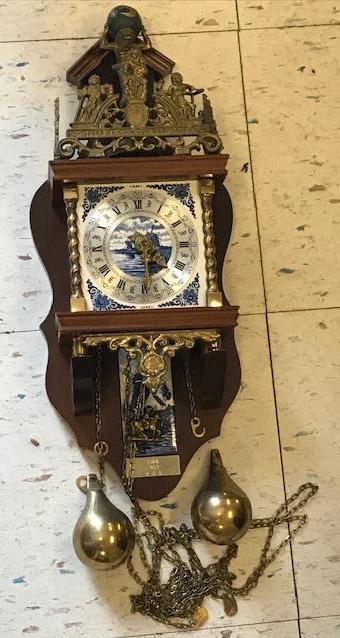 Dutch Carved Delft Clock: Nu elck Syn sin Made in Holland marked on this unusual clock 20 inches H 8"W