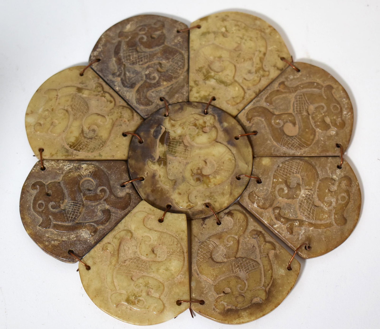 Vintage 9 Sectioned Oriental Trivet of Quartz: Catalogued as quartz , could be soapstone or jade. Vintage. Each section with varying Oriental decorations. 6 3/8"W