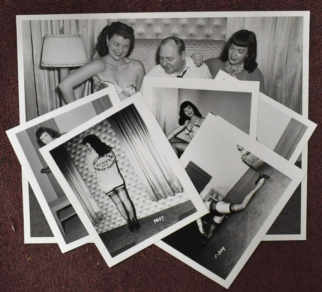 Bettie Page Photos (6): One with Irving Klaw and a second model (8 x 10) and five smaller photos (5 x 4) including one in which the back of the shirt is an advertisement for Irving Klaw pin-up photos at 212 East 14th St.