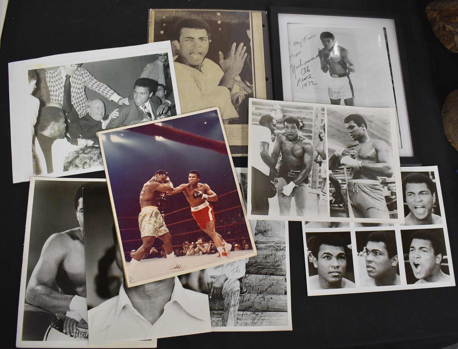 Collector’s Lot of Muhammed Ali Photos ( 10): One is an AP publicity photo after his win with Jerry Quarry, 1970; One with back stamp; One is framed and signed "to my fans, from Muhammad Ali, peace 1970. Framed. Autographed photo of Ali and Bundi