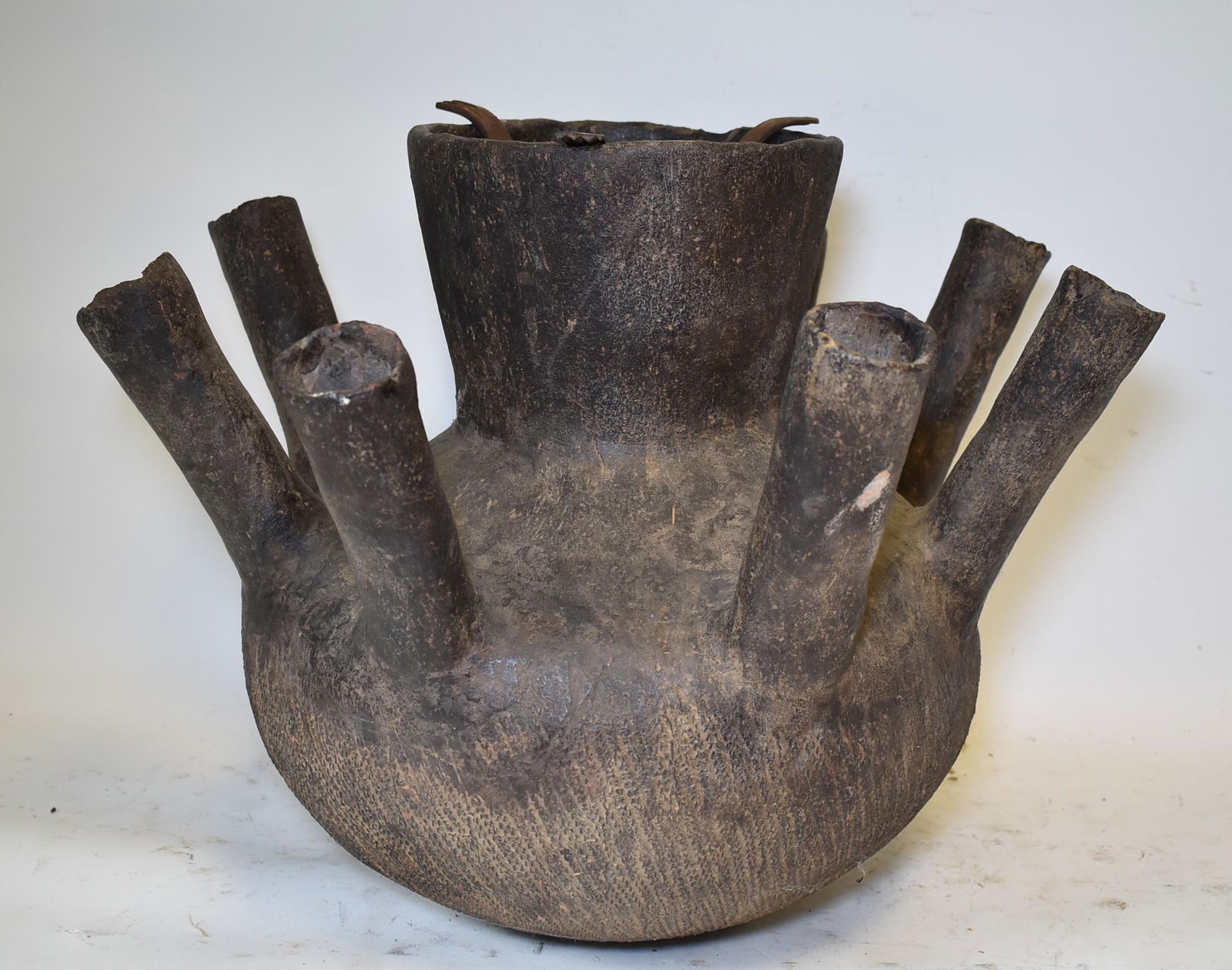 Rare Congolese Pottery Vessel: Rare and magnificent 8 tubed Congolese vessel, probably a distillery. Extremely good condition for its age. Iron insert. 18"H. 25" at widest point.