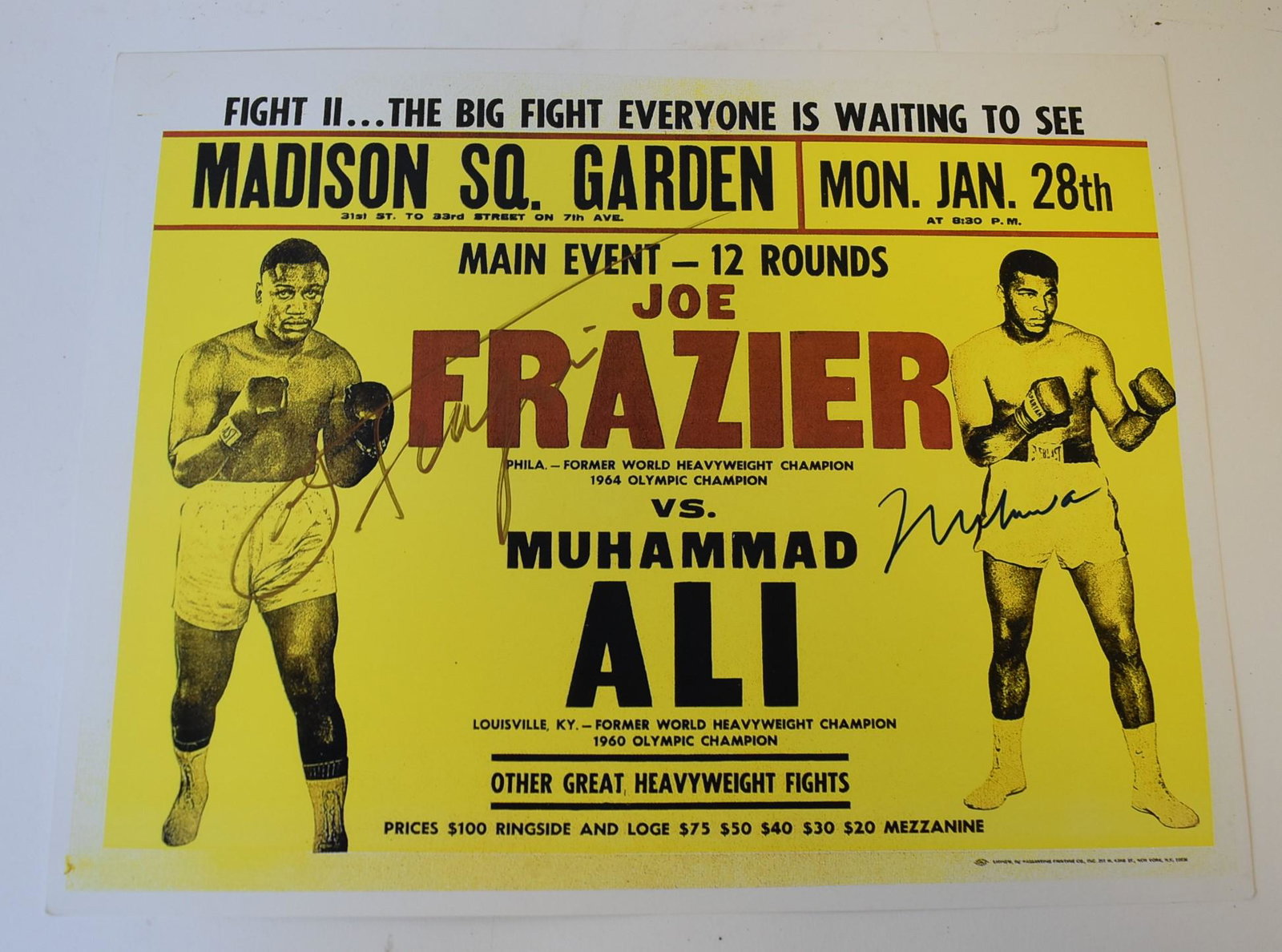 Muhammad Ali Autographed Promo Card: Autographed color promo card. Ali vs. Frazier. Fight II at Madison Square Garden. Felt tip pen signatures by both fighters; 10in. X 13in.