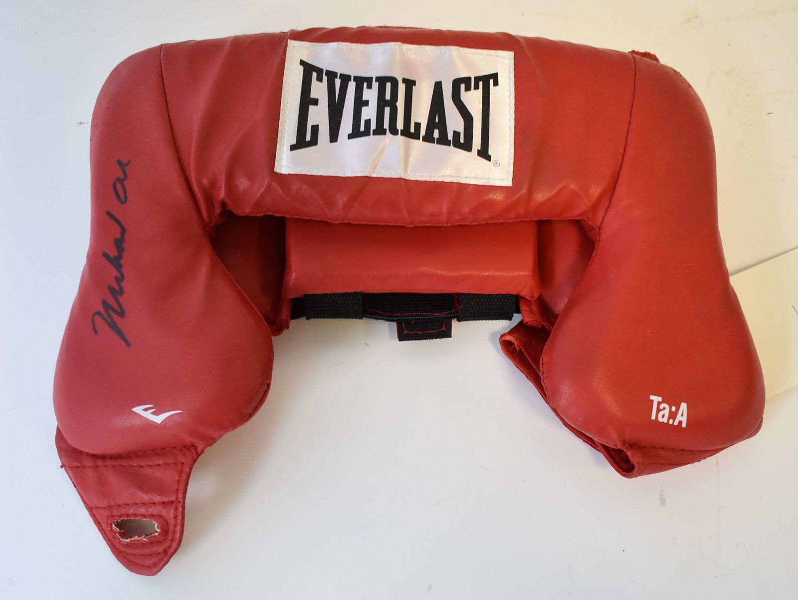 Muhammad Ali Autographed Boxing Head Protector: Autographed boxing head protector. Red Everlast. Black felt tip pen signature; 12in. 16 oz