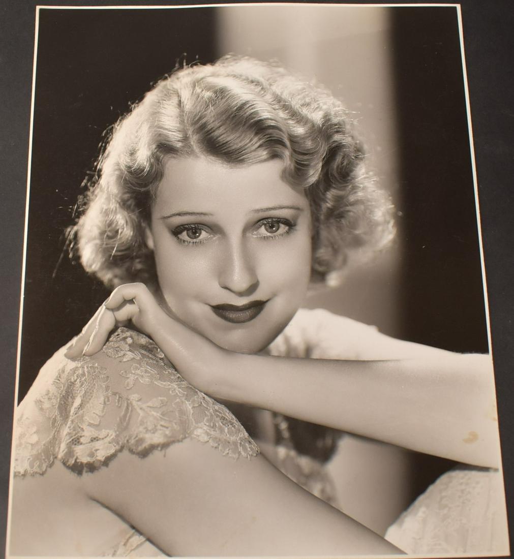 Clarence Sinclair Bull Photo of Jeanette MacDonald: An MGM publicity photo by Bull with a back stamp for the photographer and for MGM and a date stamp for 1929. Cardboard stock. 7.5 x 9.