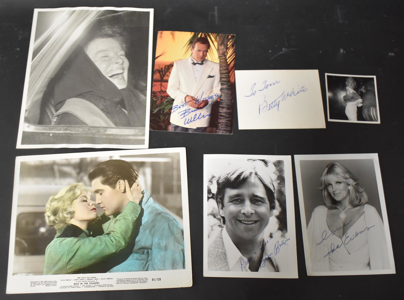 Autographs & Vintage Stills (7): Betty White (on card); Linda Evans (on a photo); Bruce Willis (on a card); Beau Bridges (on a photo); Elvis Presley with Tuesday Weld in a publicity photo for Wild in the Country; Katharine Hepburn; a