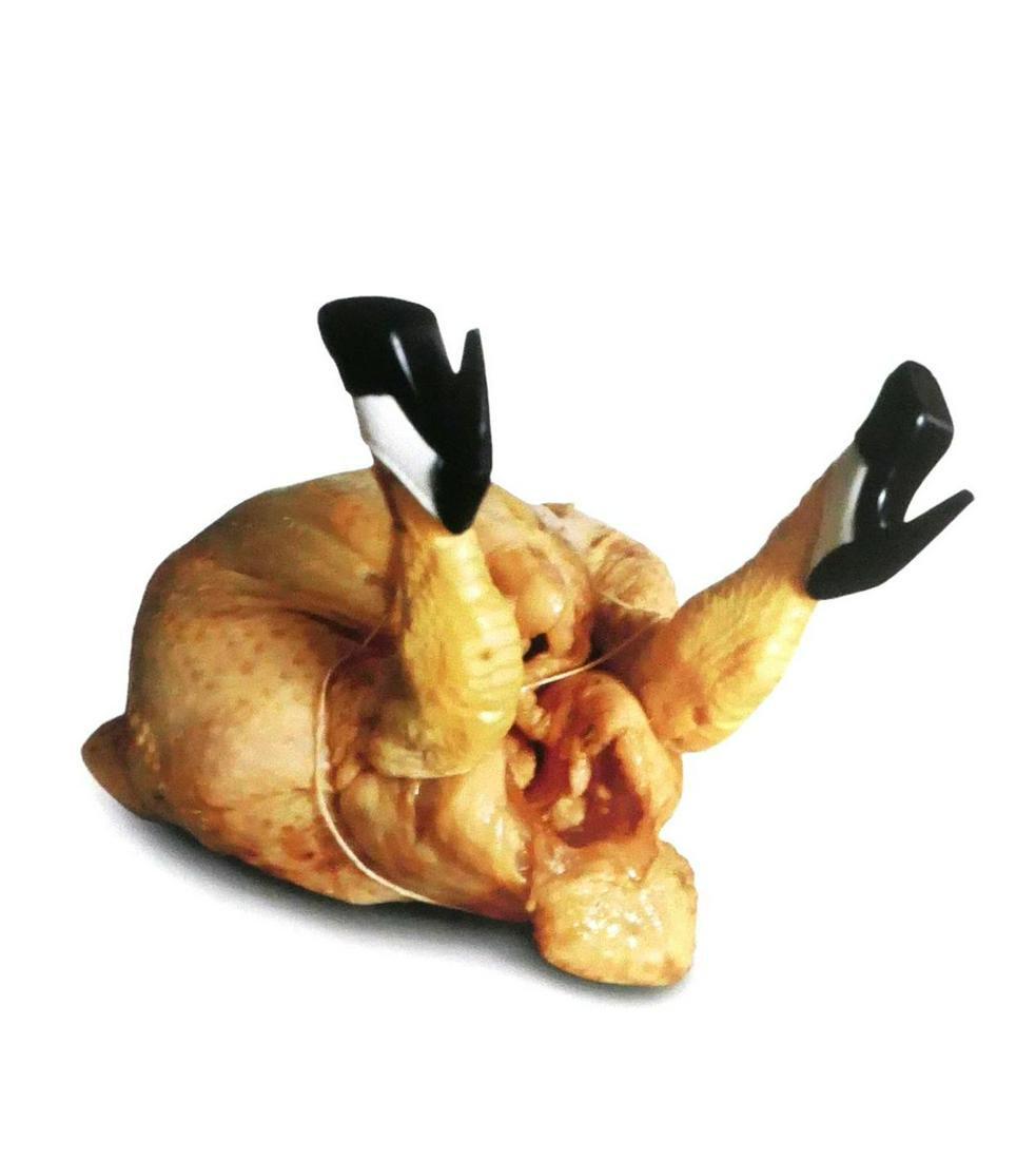 Helmut Newton Chicken In Heels Photo: Original photo by Helmut Newton, titled Chicken In Heels, measuring approximately, 11.5"x14" includes white border. Taken in 1998 and printed in 2002. It comes stamped by the photographer. The photogr