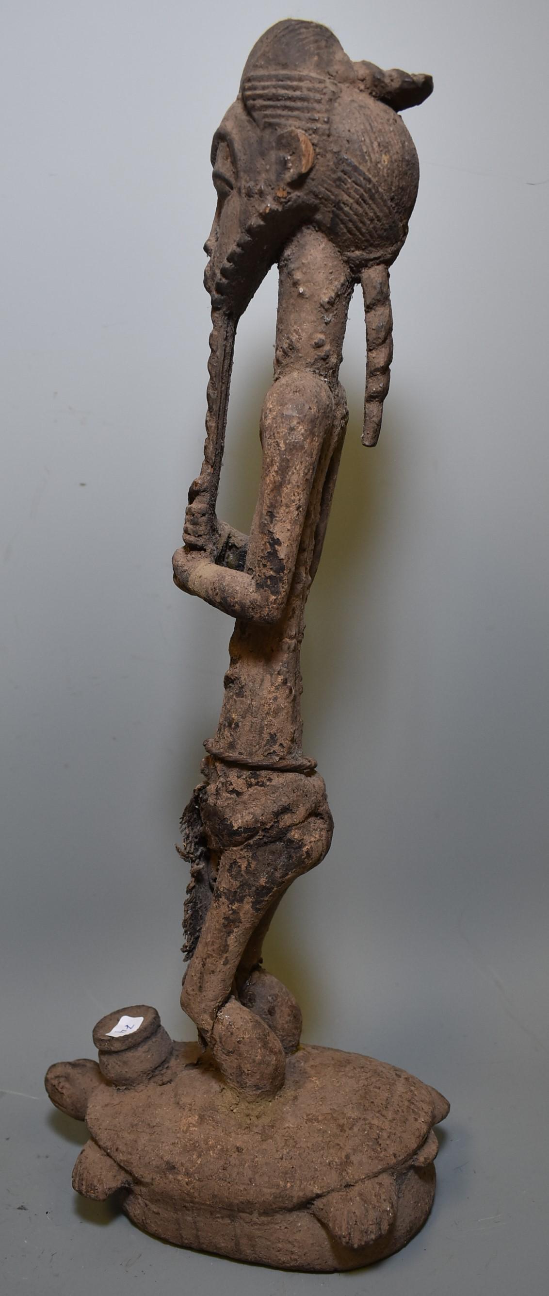 Unknown Age. Uncommon Yaure Figure: Unknown Age. Uncommon Yaure Figure. Well carved. Tall and lean male holding his tri part beard. He's astride a huge turtle. Dense deposits of magical substance? Likely tribal and early . Ancient twist