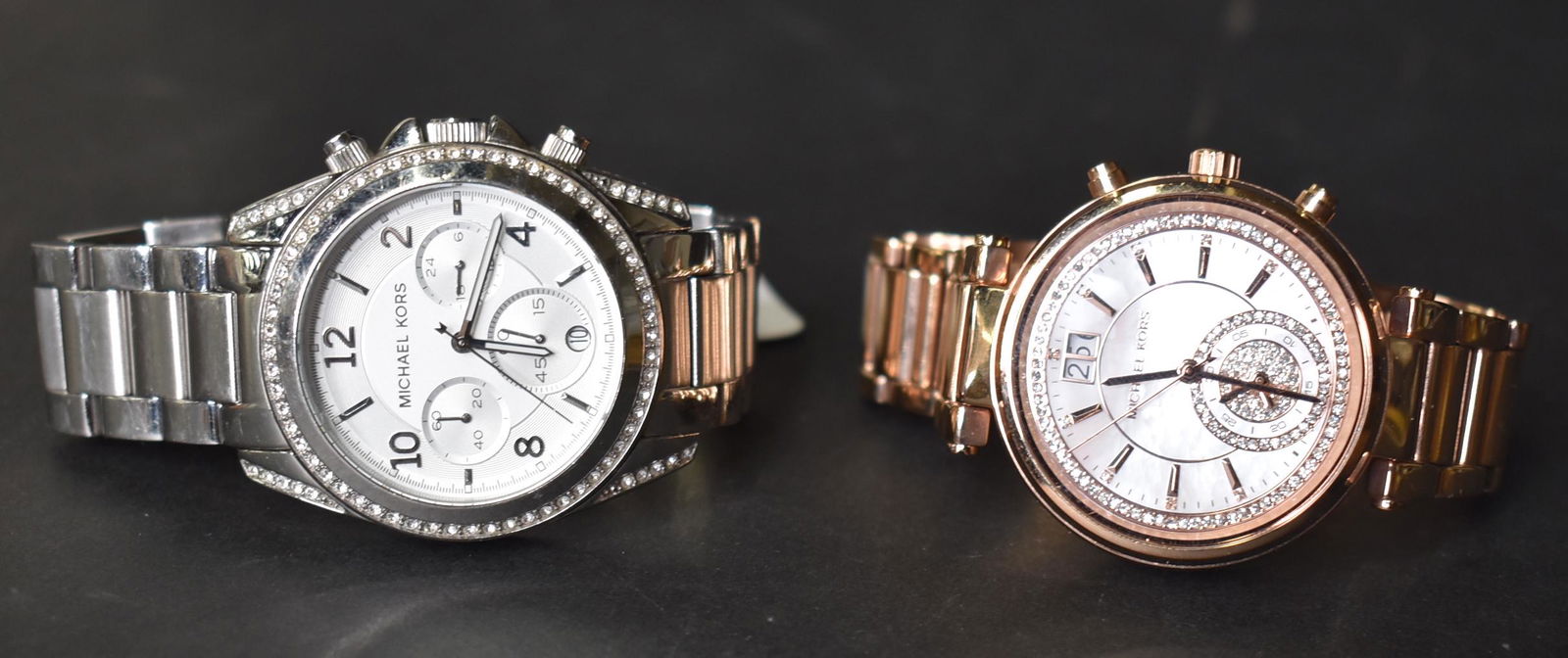 Michael Kors Ladies Wristwatches (2): One is rose gold toned and one is silver tones Two in the lot