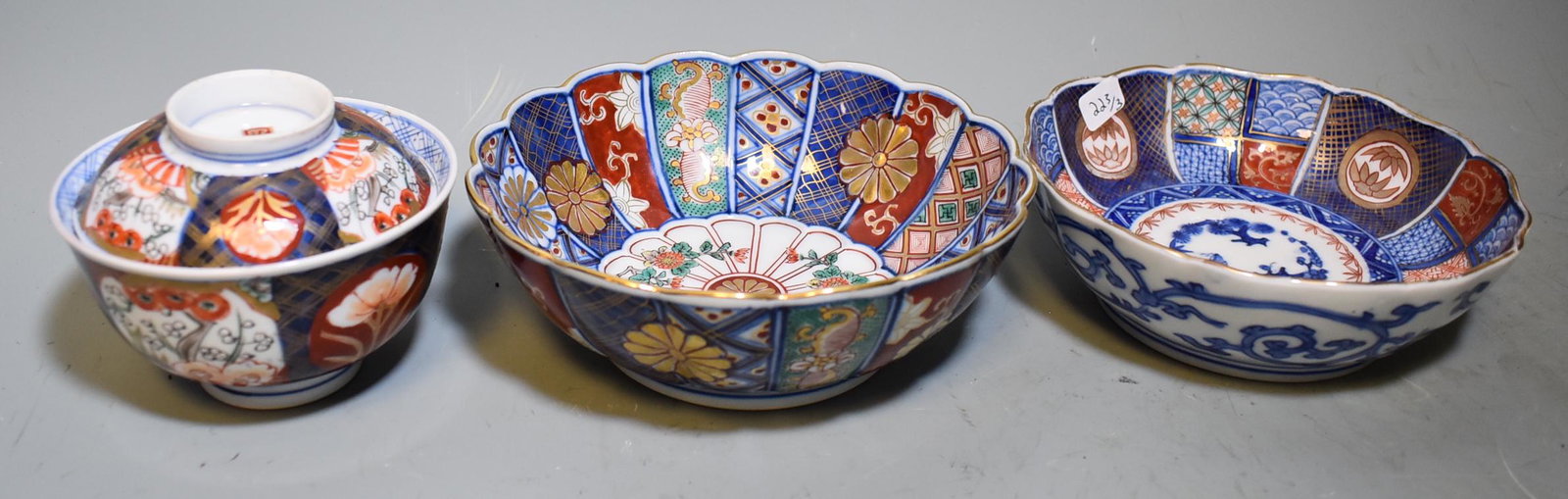 Antique Japanese Imari Bowls (3): Two bowls, decorated on the inside and the outside, both with calligraphy marks at the underside. A covered bowl decorated on the inside and outside and with calligraphy mark at the top. Smallest 1 1/