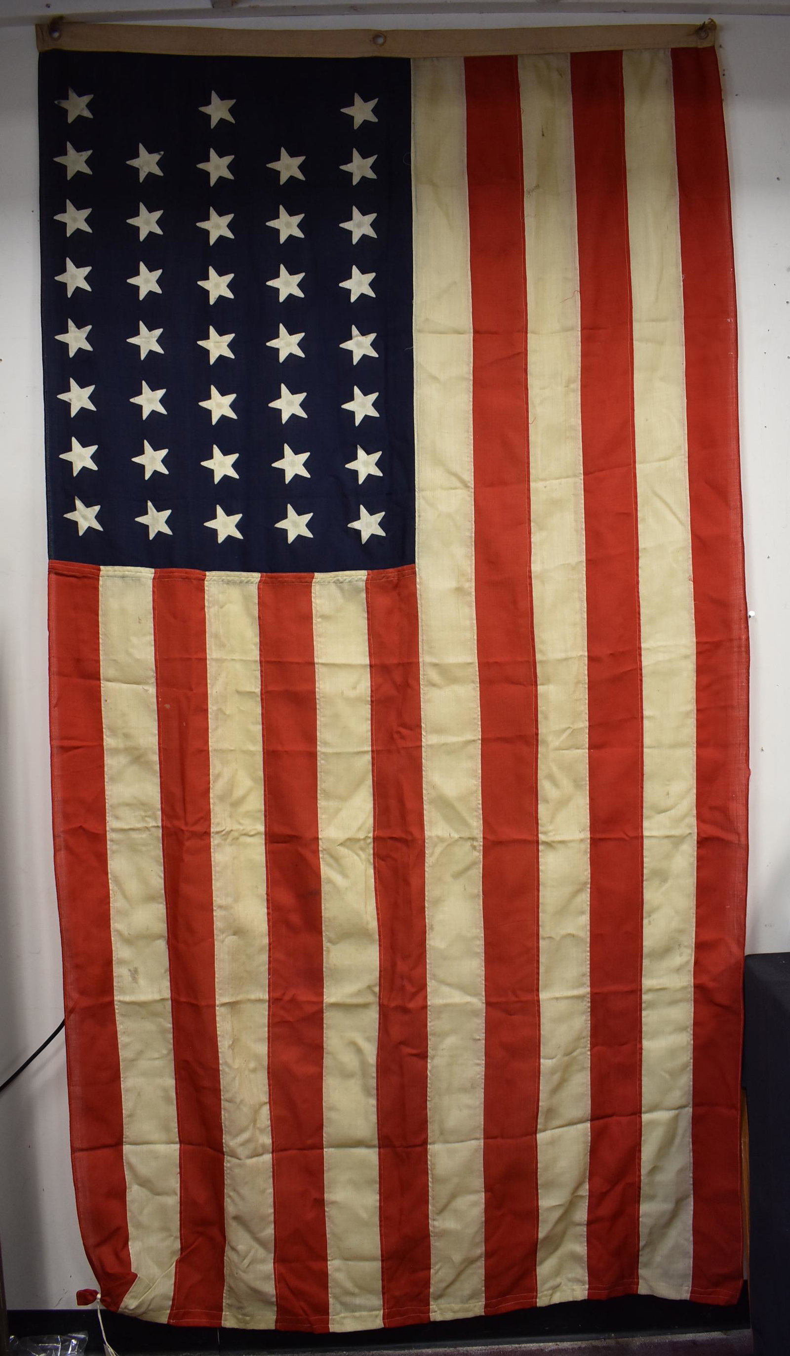 Handmade 38 Star U. S. Flag (1877-1890): This Flag became the official United States Flag on July 4th, 1877. A star was added for the admission of Colorado (August 1st 1876) and it lasted for 13 years. Condition commensurate with age as seen