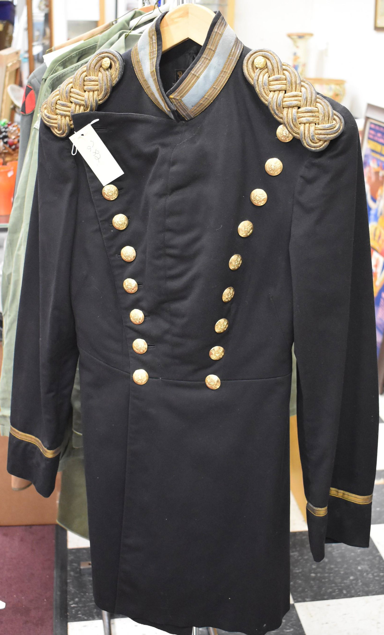 Military Jacket Poss. Civil War: May be Civil War Era. Buttons marked H.V. Alien & Co. at the backside. 18 buttons in a V shaped double breasted frnt. Two brass buttons on the epaulets. Four buttons at the back. Blue and gold collar.