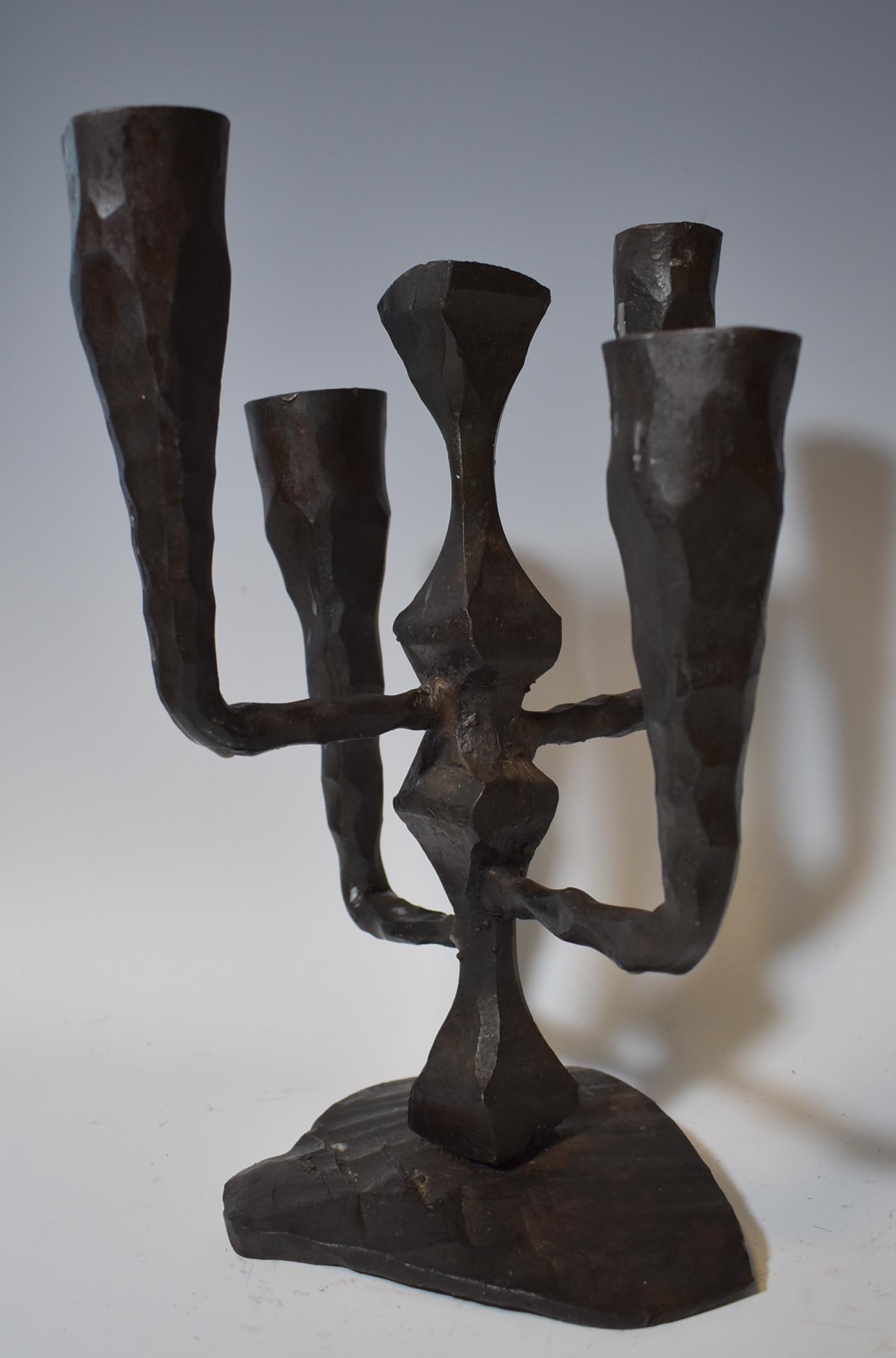 Mid Century Modern Israeli Candelabra: Mid Century Modern Israeli CandelabraIron abstract five arm candle holder. Measures approximately 12” high, labels on the underside with possibly artist’s monogram. all over good condition