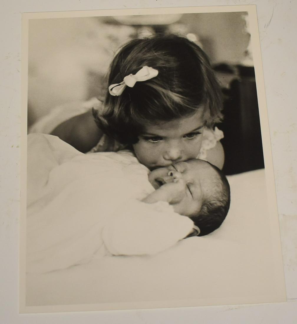 Kennedy Family Photograph: Photograph of Caroline Kennedy kissing her baby brother. Good condition. Image 7 1/4 x 9 1/4.