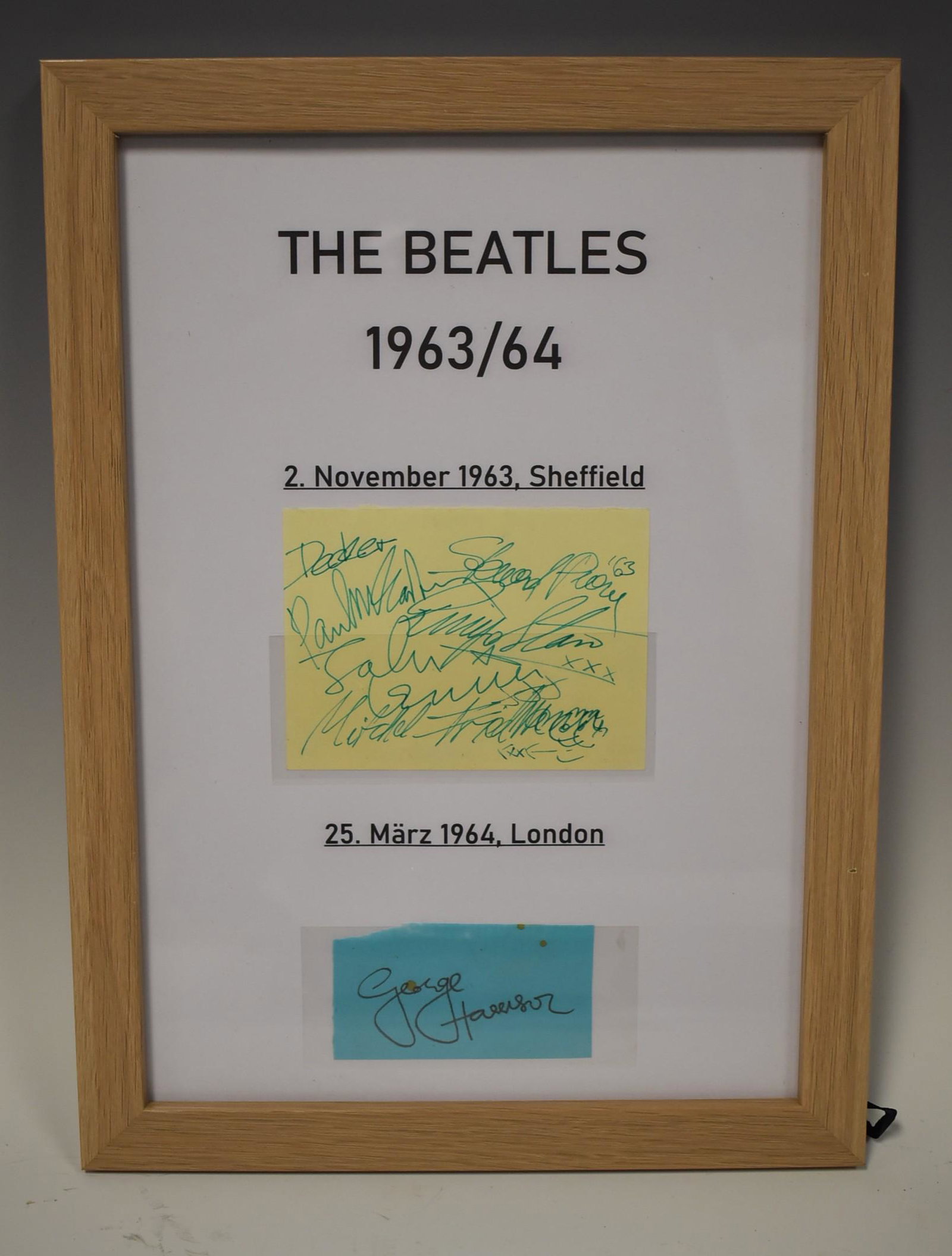 The Beatles (All 4) Autograph 1963 & 1964: An autograph from two different places. Once with the signatures of John, Paul and Ringo (11.2.63) in Sheffield and one from George on 3.25.64 in London. Framed.