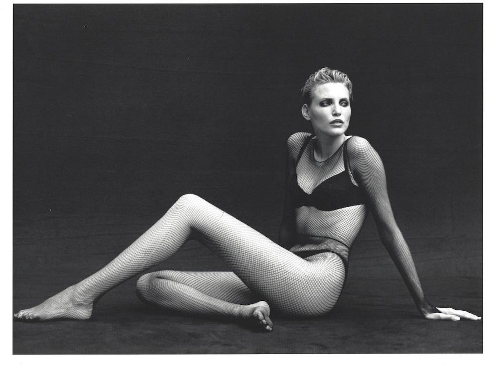 Peter Lindbergh Nadja Auermann Portrait Photo: Nadja Auermann, measures "11.25 x 8.75", inner size, 10.5"x 8". Photograph has white border. Taken in 1996, this print dated 1999. It comes stamped by the photographer with other details for publicity