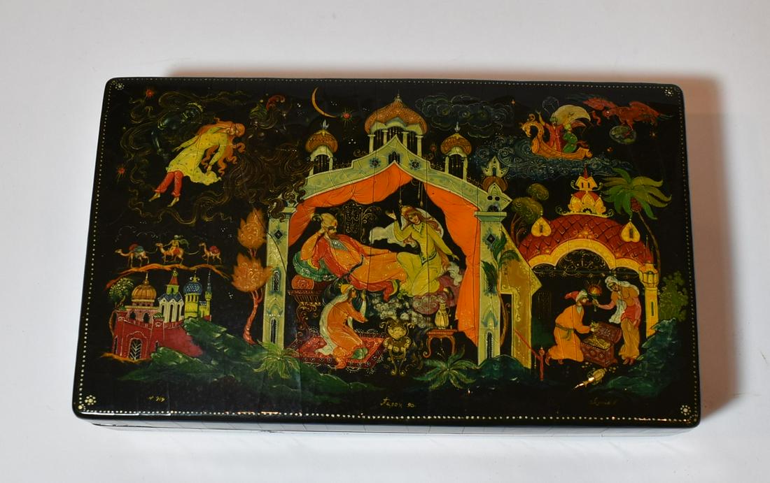 Russian Painted Box: Mytholoical scenes. Crazing at the top. Piano hinged at the back. 8" L