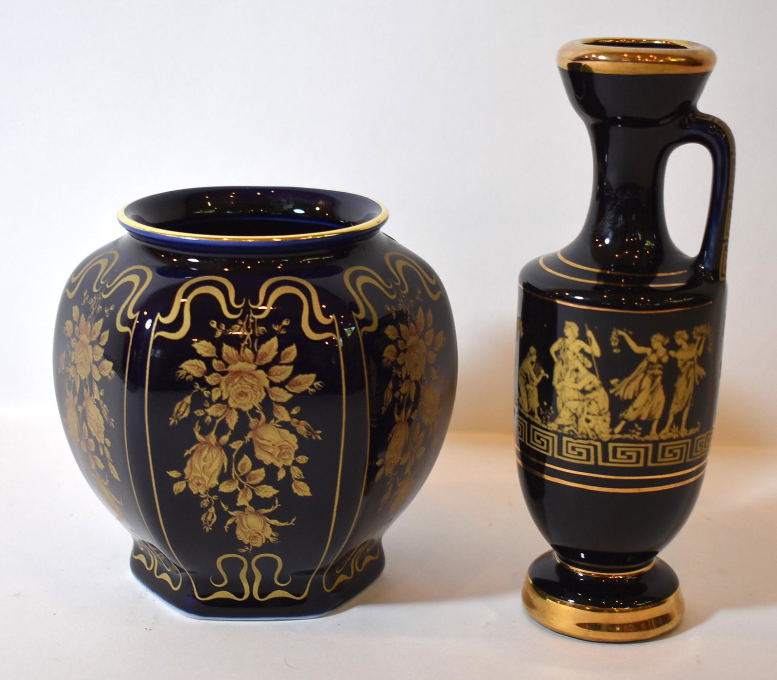 Cobalt and Gilt Vase & Ewer: The bulbous vase marked on the underside Bareuther and ECTH, the ewer marked on the underside, Greece and 22K Gold decorated. 5 1/2"H and 7 1/2"H