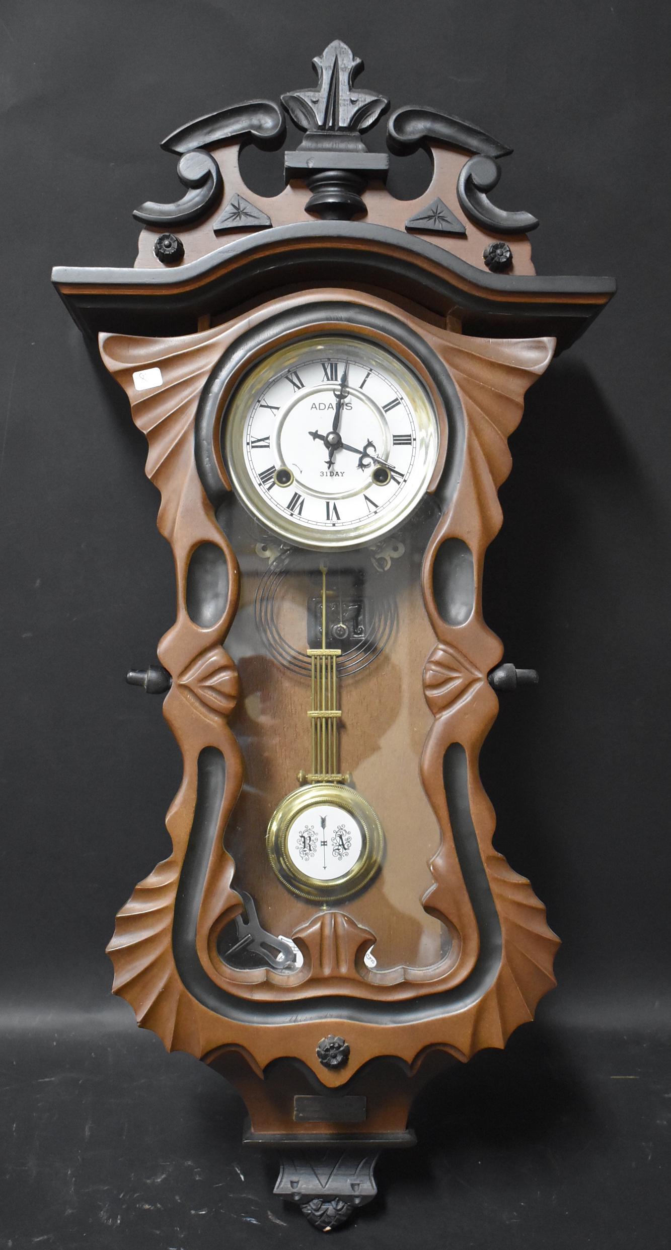 Adams 31 Day Wall Clock: Time & strike with a 25th anniversary plaque. 33" height.