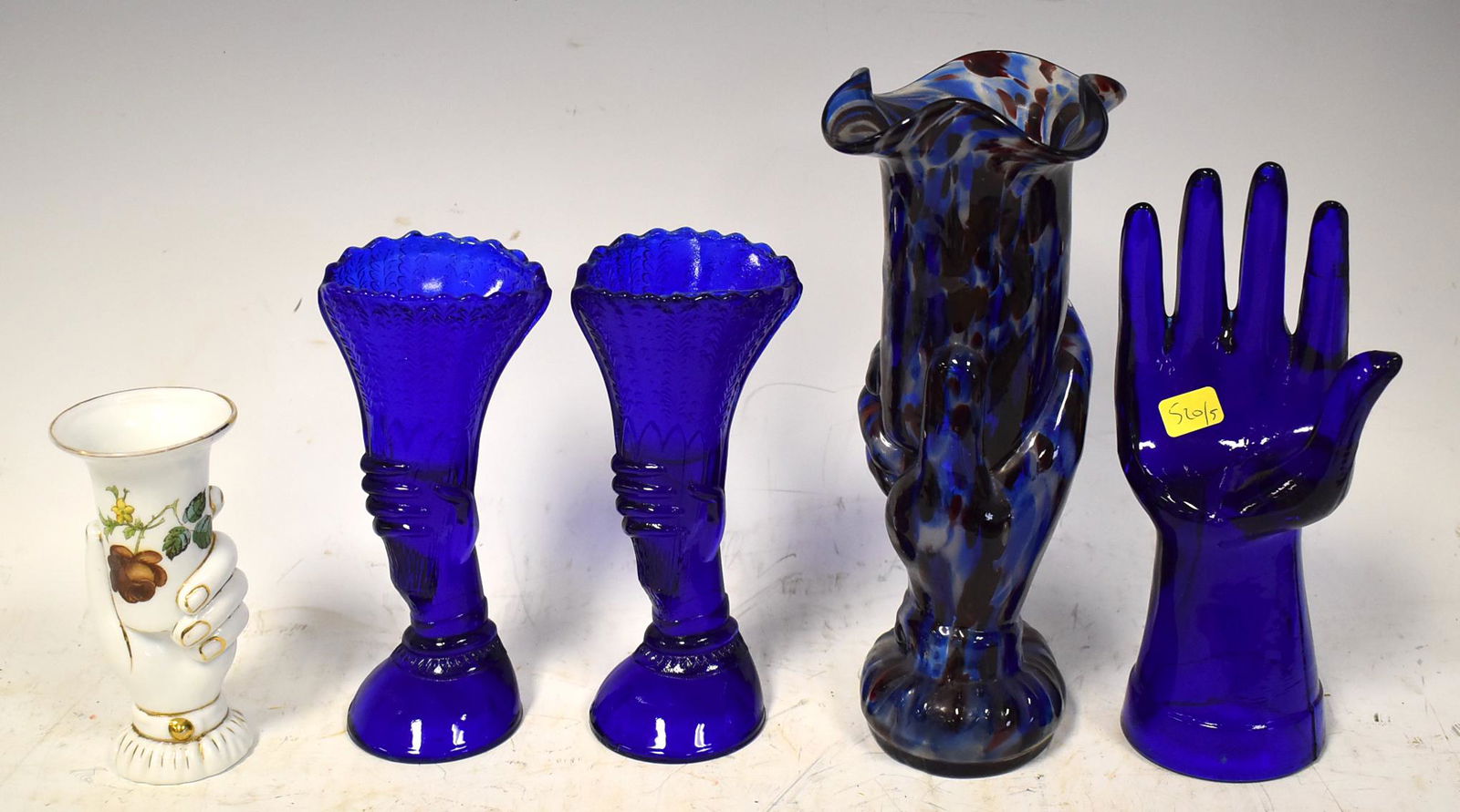 Collector's Lot of Sculptural Hands.: Lot includes cobalt glass hand ring holder, a porcelain bud vase, pair of cobalt vases, and an Italian art glass vase. Smallest to largest size is 5 to 9 inches.