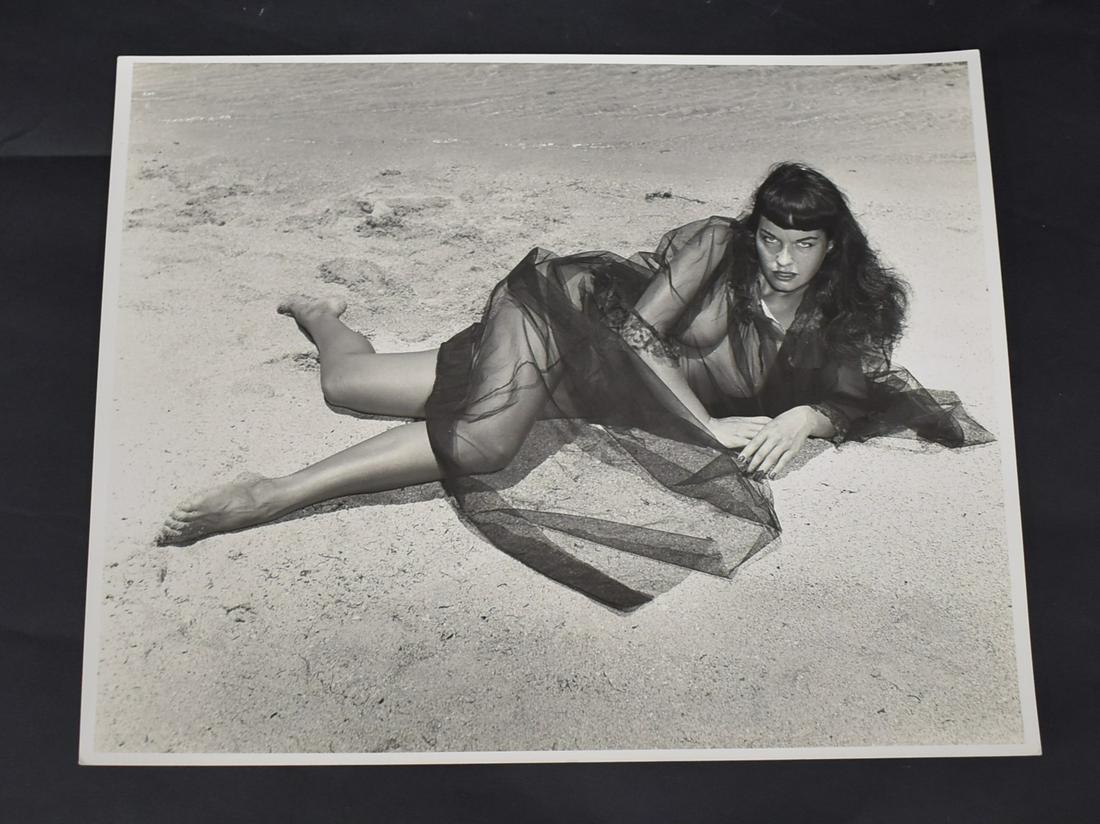 Bunny Yeager Bettie Page Photo Sgd.: Back stamp for Bunny Yeager & Eric Kroll. Flourishing Yeager signature. Double weight matte &/or semi-gloss silver gelatin..