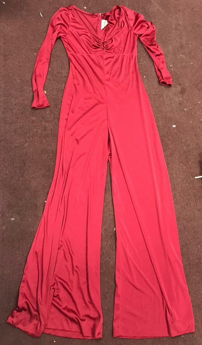 Bunny Yeager Worn Dress: The lot is accompanied by a photograph of Bunny Yeager wearing the dress at the 25th Anniversary Playboy Party at the mansion. Alberto Vargas famous pin up artist is included in the photo.