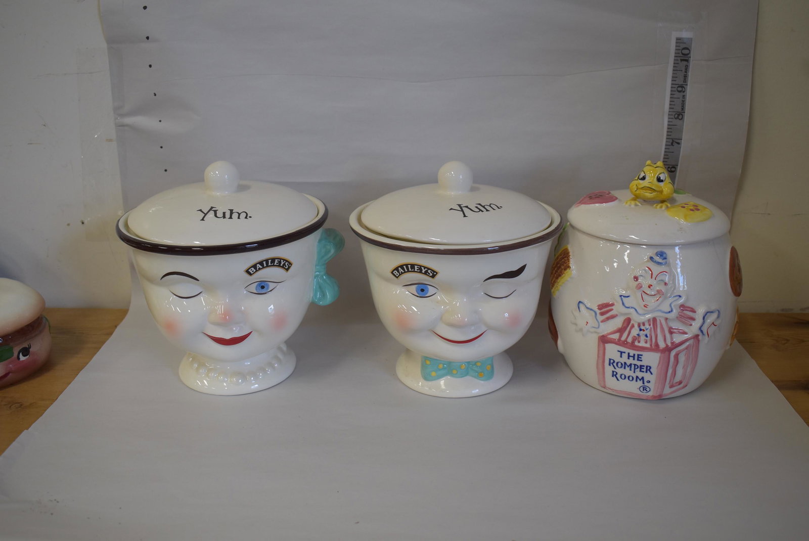 Collectors Lot of Advertising Jars (3): Baileys Boy and Girl; Mack Truck 75th Anniversary decanter; Romper Room with Do-Bee finial ; Laurel Sales , Cleveland, Ohio. Three in the lot