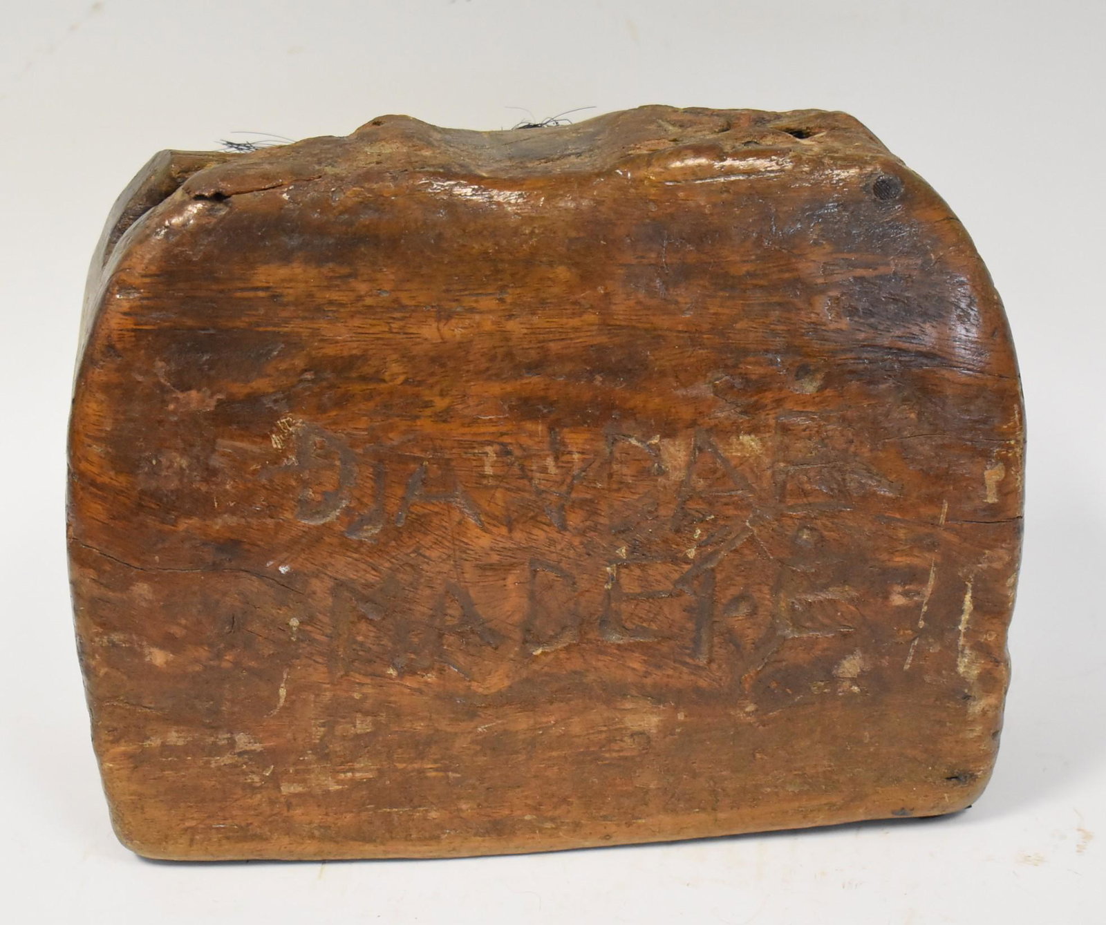 Carved African Percussion Instrument: Unknown inscriptions. 7 inches x 10 inches.