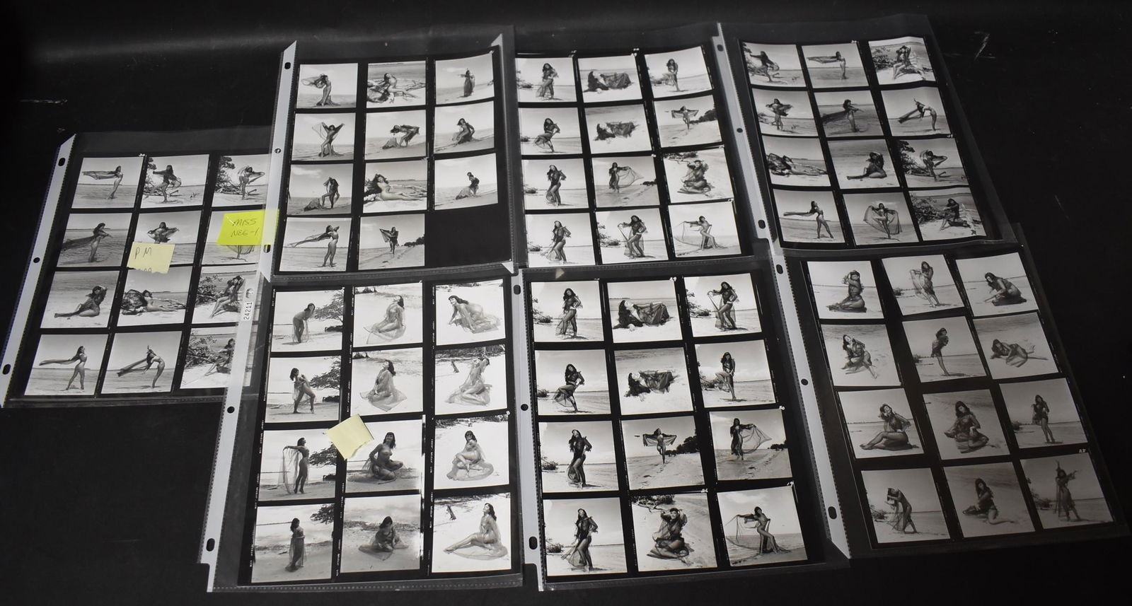 Bunny Yeager Bettie Page Contact Sheets (80+): Bettie in sheet outfit on beach. backstamped BY. Two signed by Bunny Yeager.