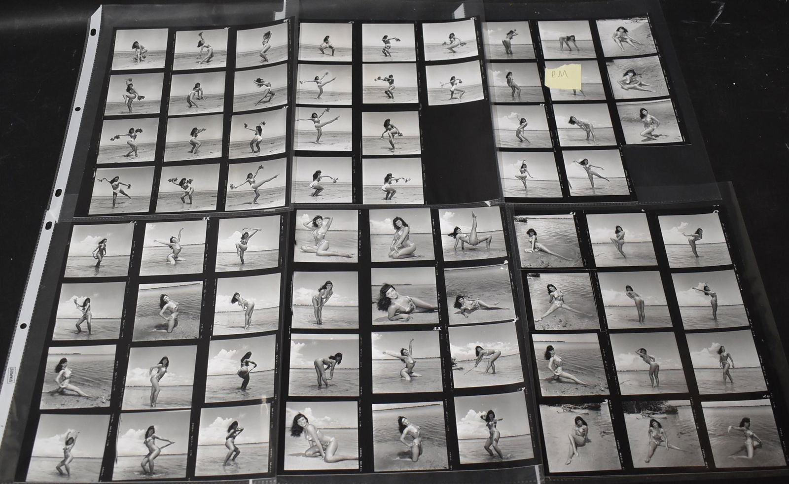 Bunny Yeager Bettie Page Contact Sheets 30+): Bettie on the beach. 2 sheets signed BY. Some backstamped.