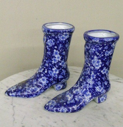 PAIR OF IRONSTONE BOOTS: pair of ironstone boots; 7in. H.