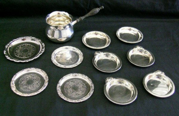 STERLING SILVER SAUCE BOAT & BUTTER DISHES: Sterling silver sauce boat by Gorham #'d N18. Turned ebony handle (worn) together with four sterling butter dishes with rose handles; two sterling butter pats by Birk; three Swedish fancy butter trays