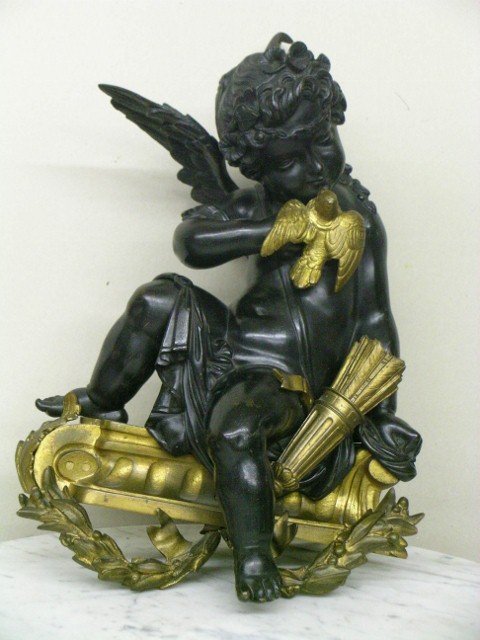 PAIR OF 19TH C. FRENCH BRONZE CHENETS: cherubim decoration; attributed to Louis Clodion(Claude Michel)14 in. H. x 10 in. W.; pair of well detailed dore bronze and dark bronze French figural bronze chenets in cherubim form.